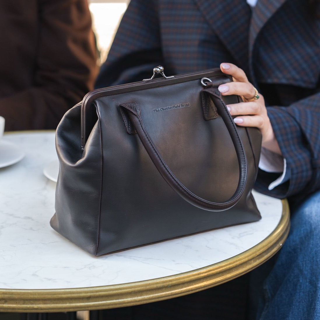 Styled Fit Perspective of Dorin Full-Grain Leather Handbag 女士 on Model - Natural Daylight Drape